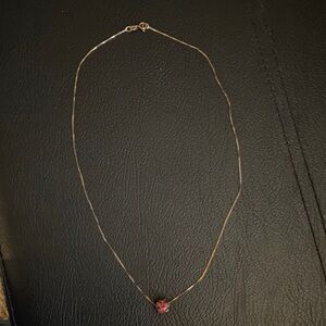 Elegant Gold Necklace with Red Pendant